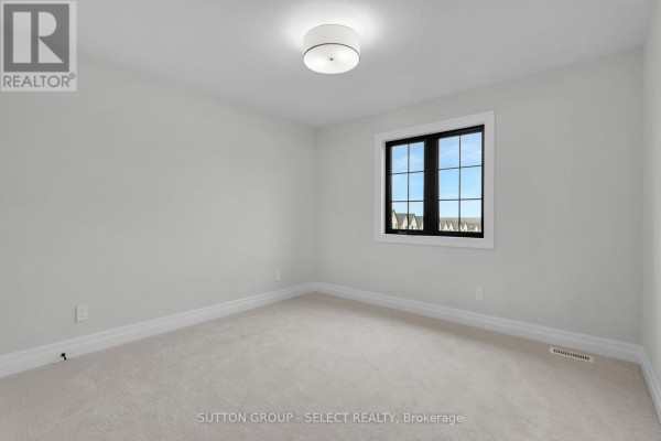 Bedroom with beige carpet and large window - 4387 Green Bend Road London South