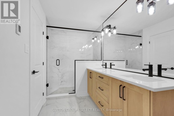 Modern bathroom with double vanity, glass shower, marble tile - 4387 Green Bend Road London South