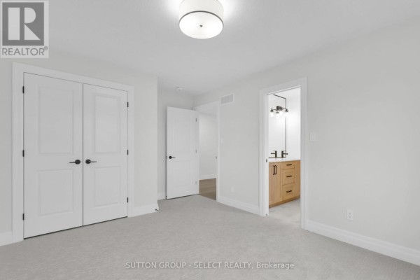 Bedroom with double closet doors and ensuite vanity - 4387 Green Bend Road London South