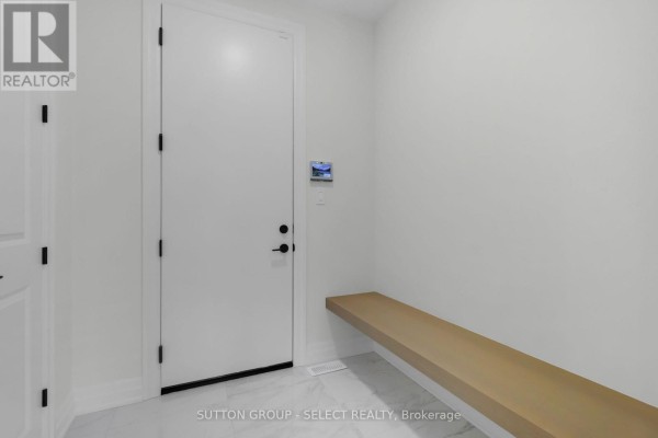 Hallway with white door, built-in bench & smart home panel - 4387 Green Bend Road London South