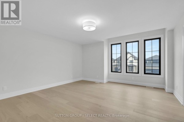 Spacious living room with hardwood floors and large windows - 4387 Green Bend Road London South