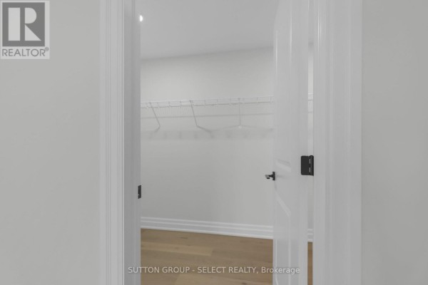 Empty walk-in closet with shelving and hardwood floor - 4387 Green Bend Road London South