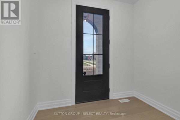 Glass-paned black door in modern hallway - 4387 Green Bend Road London South