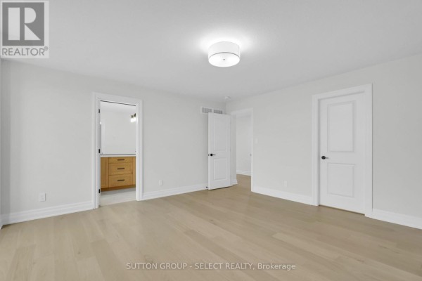 Bedroom with hardwood floors and white trim - 4387 Green Bend Road London South
