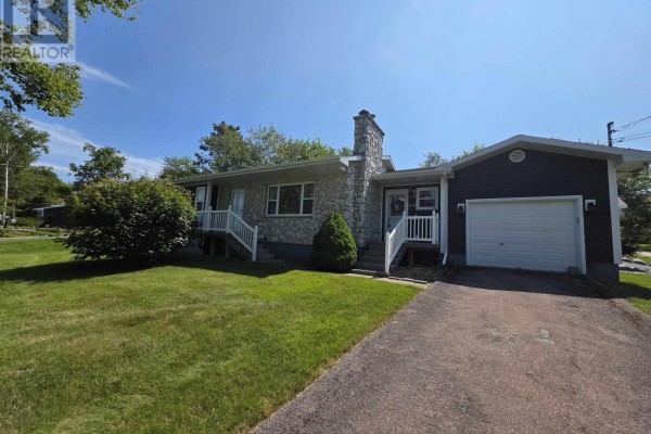 Rear view of the house showing dark grey shingle siding and two doors. - 44 Beaumont Avenue, Sydney River