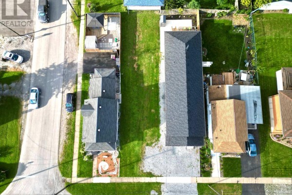 Aerial view of multiple residential lots, showcasing green lawns and surrounding properties. - 44 Chestnut Street, Port Colborne