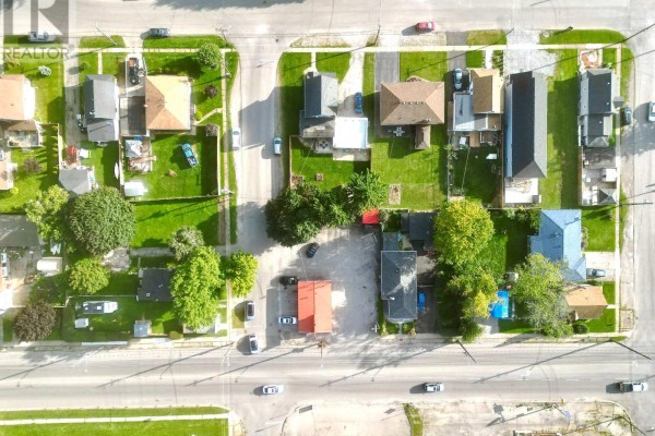 Bird's eye view of a neighborhood with various houses and green spaces. - 44 Chestnut Street, Port Colborne