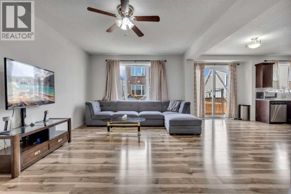 Entryway with tile flooring, front door, and staircase - 44 Cityside Rise Ne, Calgary