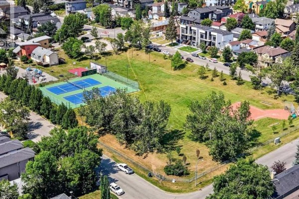 Aerial view of a park with tennis courts and a playground. - 440 53 Avenue Sw, Calgary