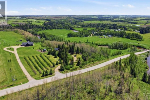 Overhead view of property featuring a house, trees, and expansive rural landscape. - 440029 Range Road 30, Rural Ponoka County