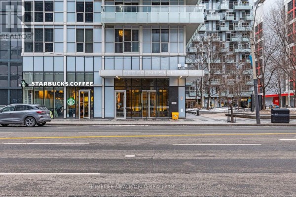 Street view of the building entrance with a Starbucks on the left. - 4406 - 300 Front Street W, Toronto
