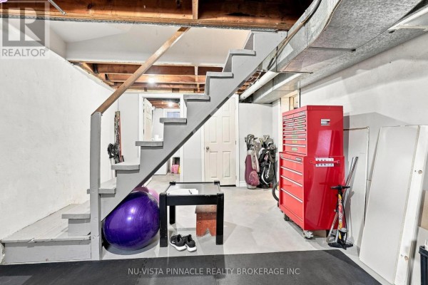 Basement with exercise ball, golf clubs, and red tool chest - 442 Grandview Avenue Wilmot