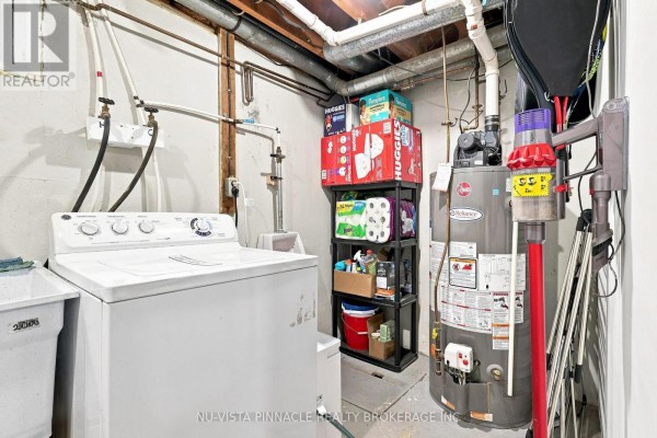 Washing machine, utility sink, water heater, and storage shelves - 442 Grandview Avenue Wilmot