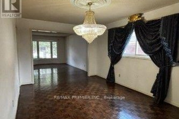 Living room with chandelier and parquet floors - 4464 Stonemill Court Mississauga