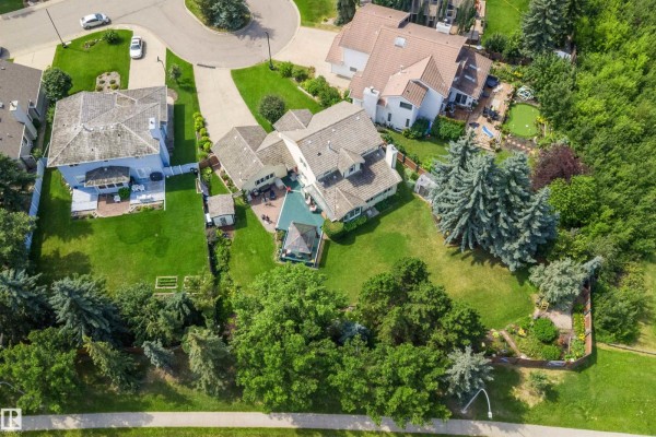 Aerial view of the property showing the house, backyard, and surrounding neighborhood. - 45 Blue Quill Cr Nw, Edmonton