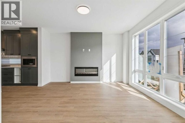 Family room - 45 Bluerock Hill Sw, Calgary, AB T2Y0V7 Photo 3