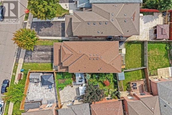 Overhead aerial view of the property, showing the house, backyard layout, and surrounding homes. - 45 Sahara Trail, Brampton