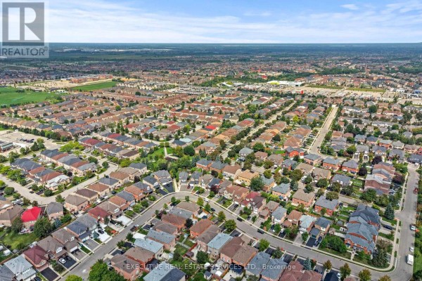 Aerial view of suburban homes with trees and residential streets - 45 Sahara Trail Brampton
