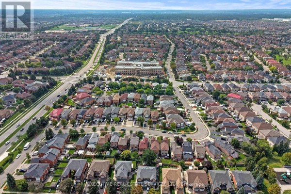 Aerial view of suburban houses and streets with a building under construction - 45 Sahara Trail Brampton
