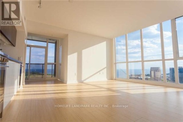 Bright living room with floor-to-ceiling windows and light wood floors. - 4506 - 85 Queens Wharf Road, Toronto