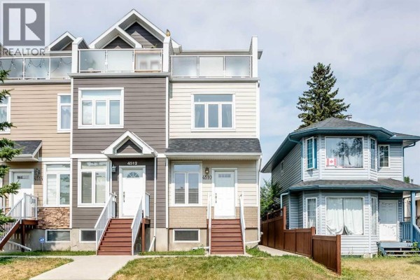 Side-by-side exterior view of two townhouses, one with beige siding and the other with grey. - 4510 73 Street Nw, Calgary