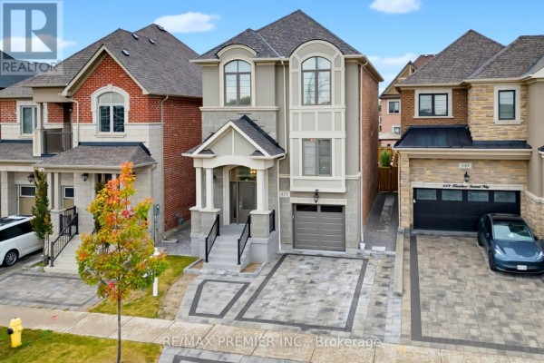 Aerial view of the front of a modern two-story house with a double garage. - 453 Kleinburg Summit Way, Vaughan