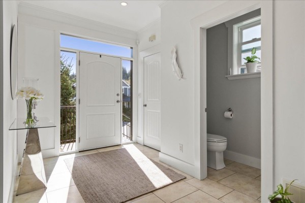 Interior entryway with tiled floor, white walls, and double front doors. - 45425 Ariel Place, Vedder Mountain, Cultus Lake