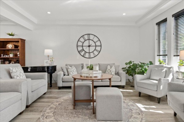 Living room with two sofas, armchairs, a piano, and a large wall clock. - 45425 Ariel Place, Vedder Mountain, Cultus Lake
