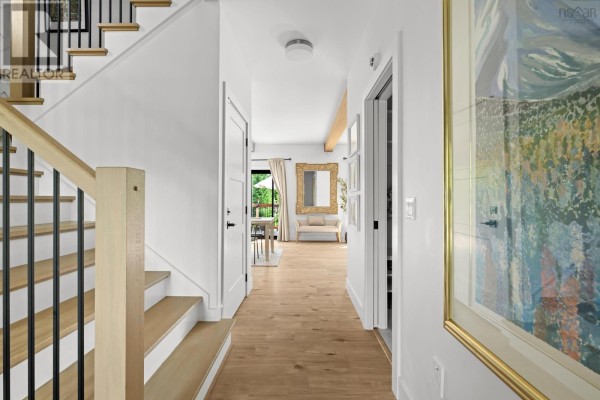 Open-concept kitchen featuring white countertops, stainless steel appliances, and pendant lighting - 456 Magenta Drive, Middle Sackville