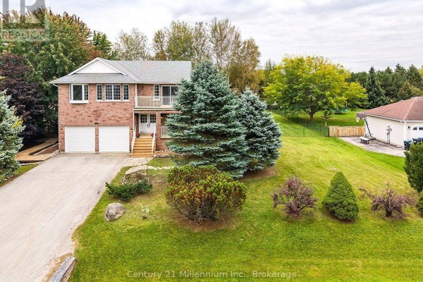 Front view of 46 Donald Avenue, a brick house with a double garage, balcony, and manicured lawn. - 46 Donald Avenue, Clearview