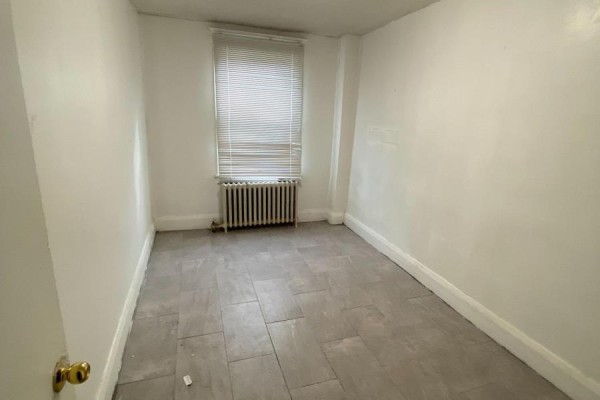 Small room with white walls, grey tiled floor, and a window with blinds. - Main Floor - 46 Rockcliffe Boulevard, Toronto