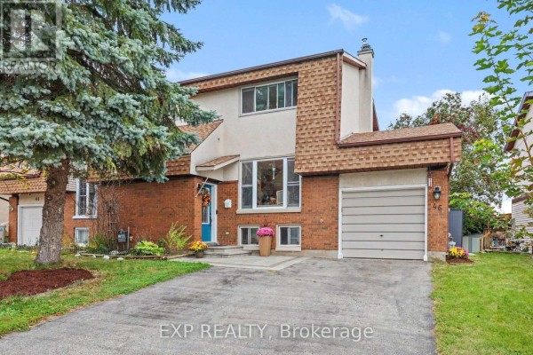 Exterior of a residential townhouse during the day with a driveway. - 46 Westcliffe Street, Ottawa