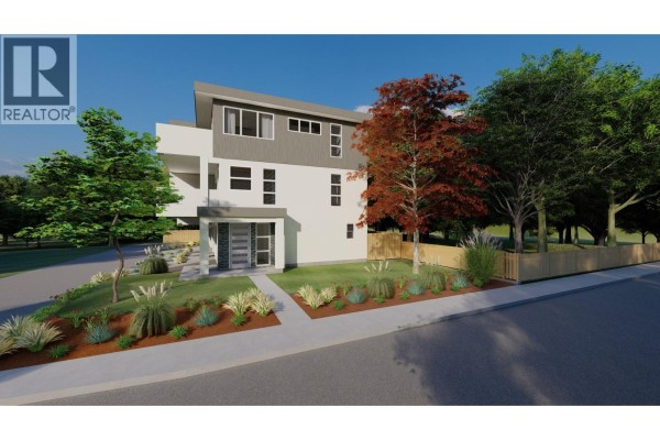 Kitchen with white cabinetry, stainless steel appliances, island with stools, and wood floors. - 463 Wade Avenue Unit# 101, Penticton