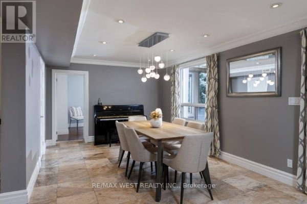 Dining room with table, chairs, piano, chandelier, and mirror - 4653 Dundas Street W Toronto