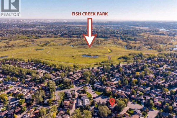 Aerial view showing the property's proximity to Fish Creek Park. - 47 Midvalley Rise Se, Calgary