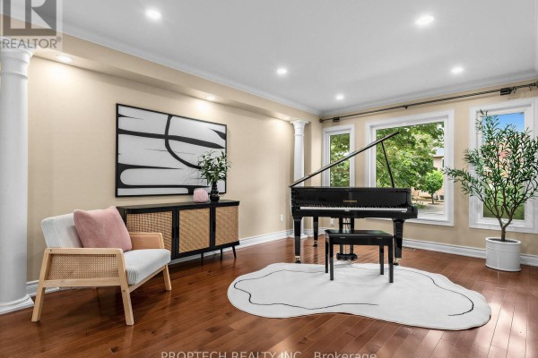 Living room with a grand piano, modern armchair, buffet cabinet, and hardwood floors. - 47 Topham Crescent, Richmond Hill
