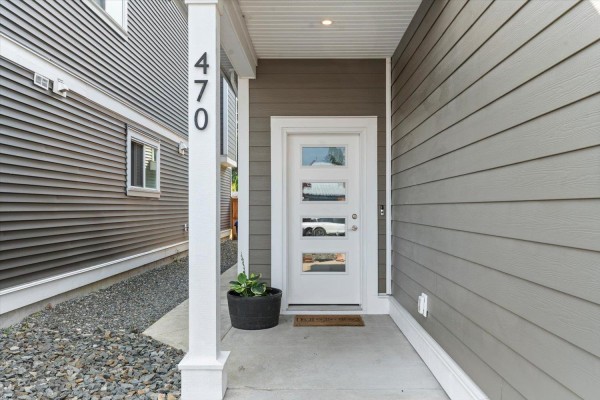 Entrance to a townhouse at 470 Fort Street with a white door and windows. - 470 Fort Street, Hope, Hope
