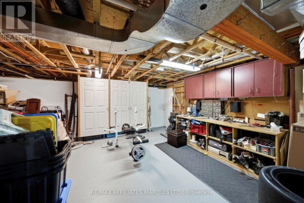 Weight bench and workbench in finished basement - 4720 O'keefe Road South Stormont