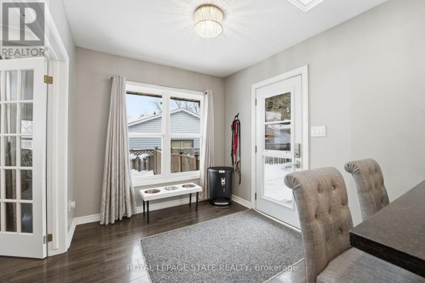 Tiled shower, modern vanity, and pedestal toilet in a bathroom - 473 Mohawk Road W Hamilton