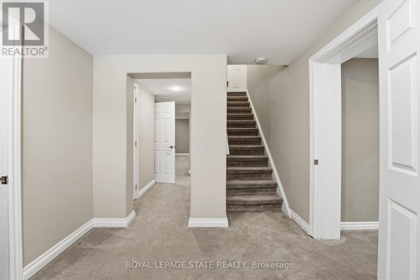 Dining room with table, chairs, chandelier, and mirror - 473 Mohawk Road W Hamilton