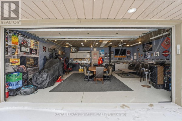 Covered patio with outdoor furniture, grill, and dining set - 473 Mohawk Road W Hamilton