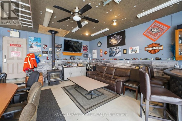Two-car garage with beige door and windows - 473 Mohawk Road W Hamilton