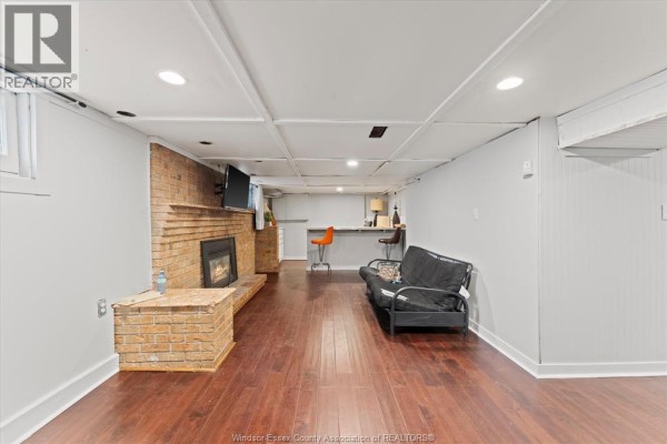 Hallway with white door, blue curtains, and grey floor - 475 Mckay Avenue Windsor