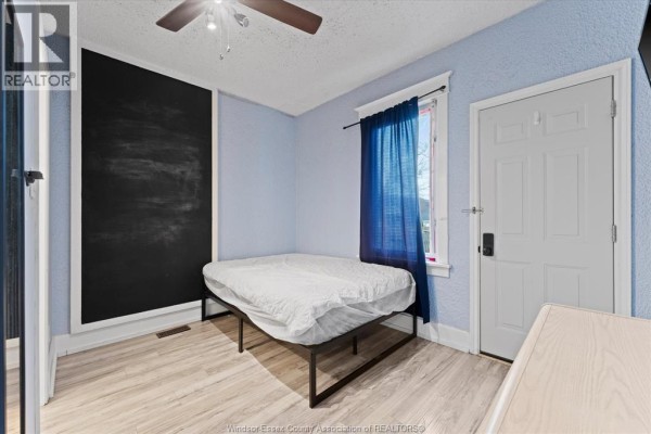 Modern bathroom with vanity, mirror, and shower - 475 Mckay Avenue Windsor