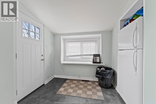 Backyard with grill, paved patio, and outbuilding - 475 Mckay Avenue Windsor