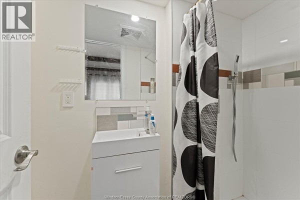 Kitchen with white refrigerator, coffee maker, and front door - 475 Mckay Avenue Windsor
