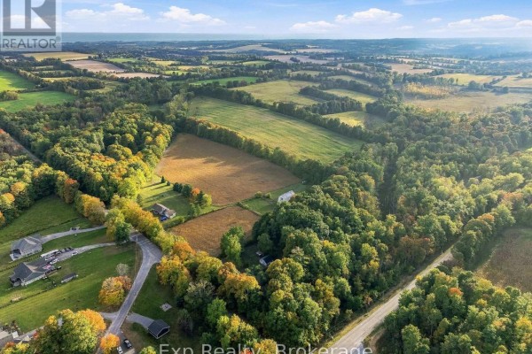 Aerial view of a rural landscape with fields, trees, and scattered houses. - 478 Trottman Road, Cramahe