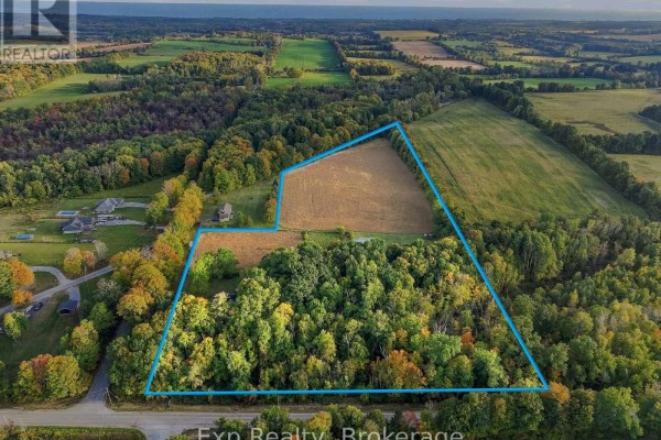 Aerial view of a large property outlined in blue, showing fields and woodland. - 478 Trottman Road, Cramahe