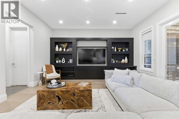 Modern home exterior with stone accents, two-car garage, and manicured front yard. - 4820 7a Avenue, Delta