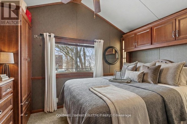 Kitchen with wooden cabinets, stainless steel appliances, and a double sink. - 485b - 5139 Halstead Beach Road, Hamilton Township